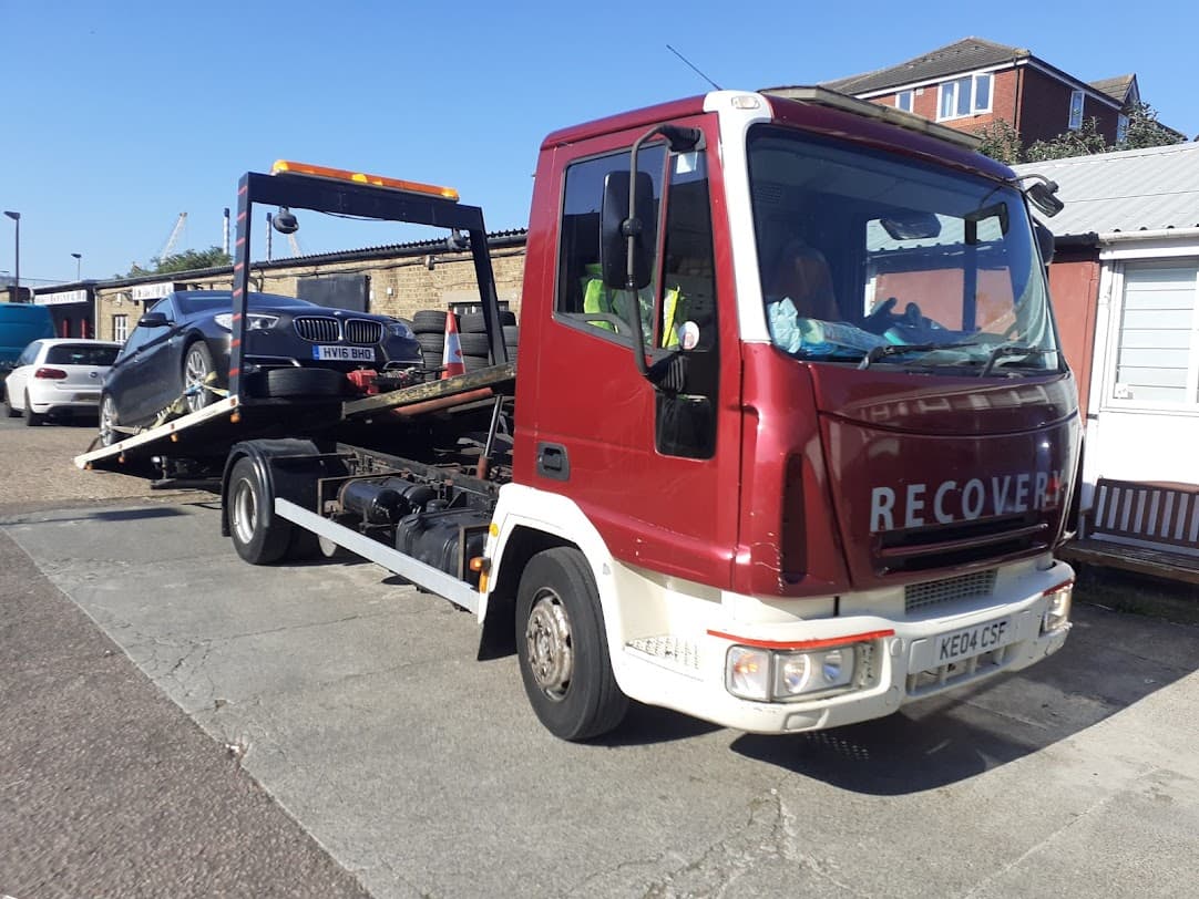 Recovery truck carrying a BMW